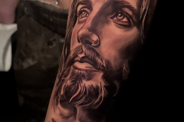 Black and Gray Grey Religious Jesus Tattoo Done at Skylla Tattoo Studio in Arlington, Texas by Bravo