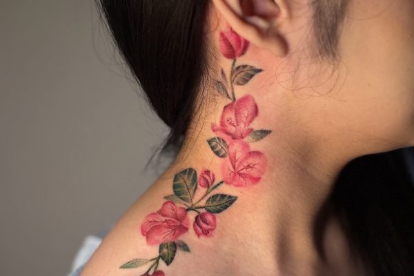 Floral Flowers Vine Beautiful Feminine Delicate neck tattoo by Erika at Skylla Tattoo Studio in Arlington Texas